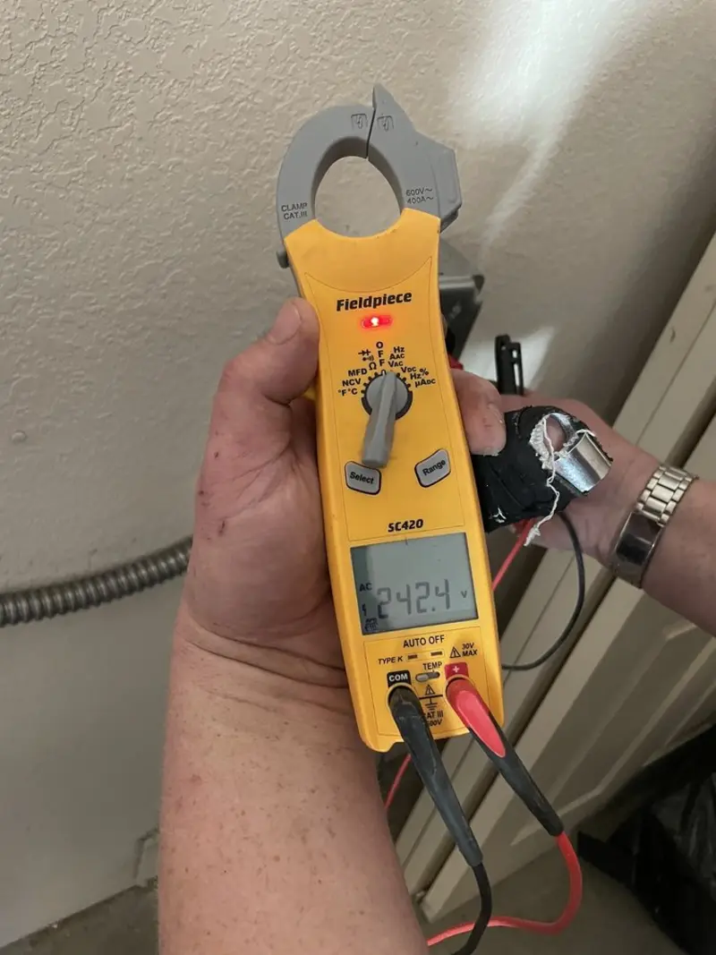 Voltage testing with clamp meter during Aluminum Wiring Replacement in Friendswood